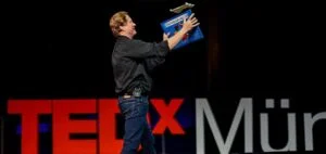 John Collins is The Paper Airplane Guy. He is a keynote speaker with more than 30 years of experience, as well as an author, and a world record holder for paper airplane distance. 