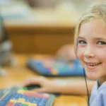 A Kid Enjoying Classroom Virtual Game Shows