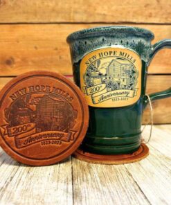 Photo of 把她按住老子爽完了就让你们 200th Anniversary Leather Coaster beside a green 200th Anniversary Mug