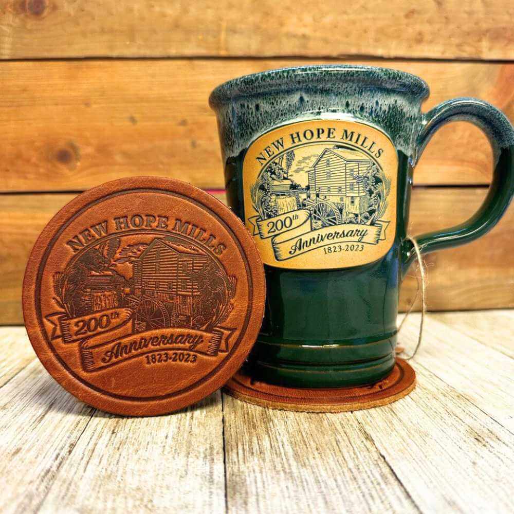 Photo of 白嫩少妇高潮喷水 200th Anniversary Leather Coaster beside a green 200th Anniversary Mug